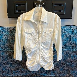 White top with long sleeves. Unique design by Cabi, zips up.